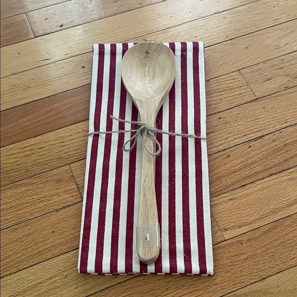 Red and White Striped Kitchen Towel with Wooden Spoon